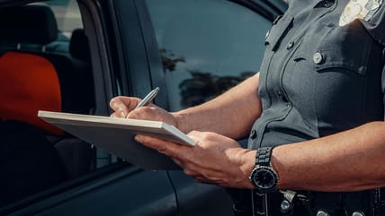 Police officer writing a ticket