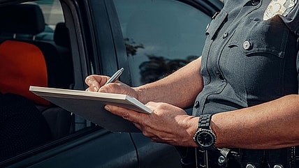 Police officer writing a ticket