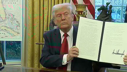 Donald Trump Signing an Executive Order on Auto Tariffs