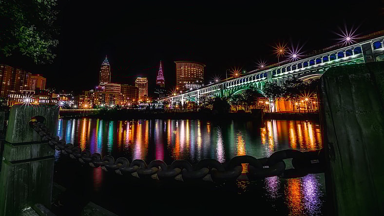 reflection of illuminated buildings in water at night