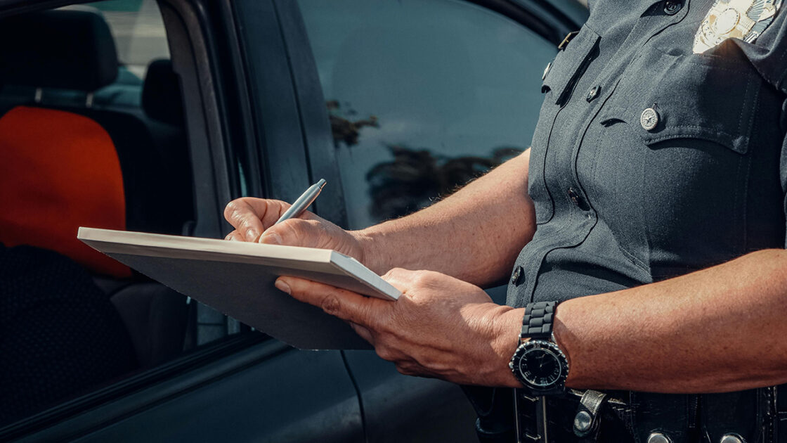 Police officer writing a ticket