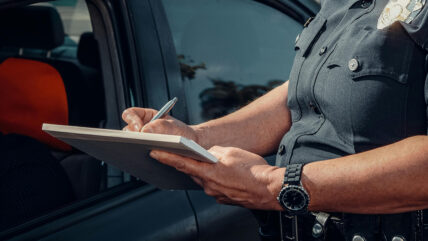 Police officer writing a ticket