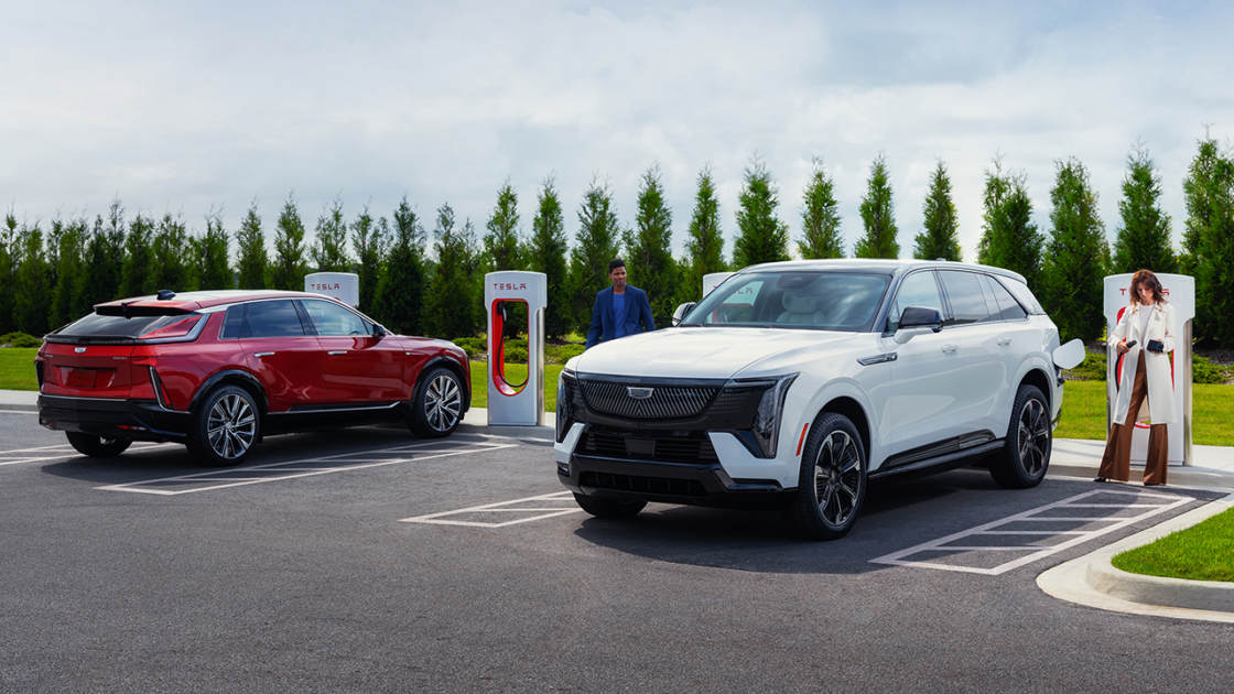 Cadillacs charging at a Tesla Supercharger