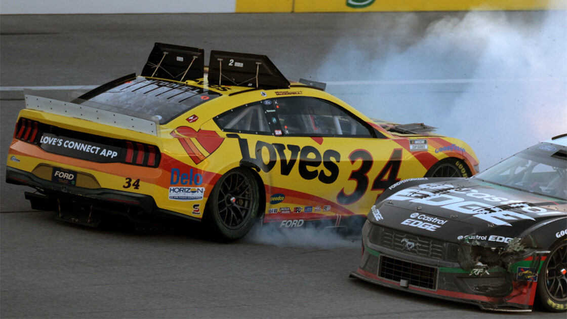 A NASCAR Cup Series car with the roof flaps open