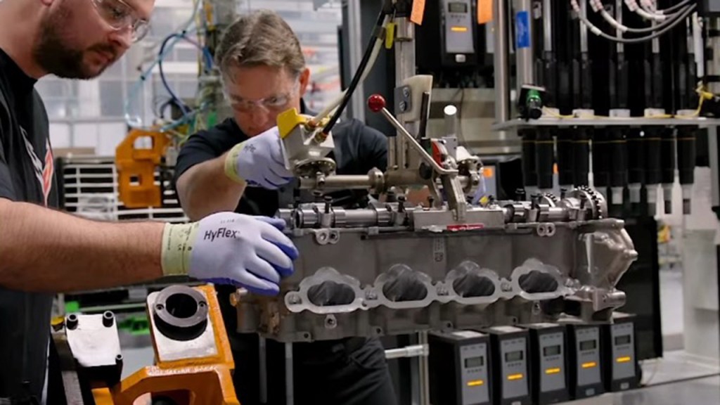 Jeff Gordon working on a Corvette engine.